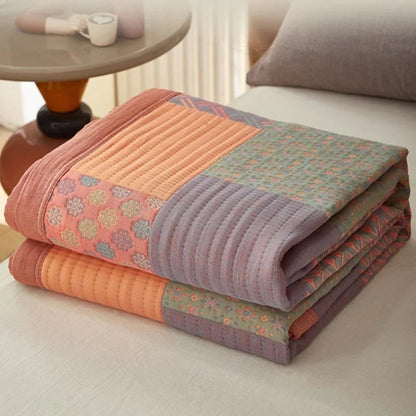 Liora Quilt — Vendbart Bomuldspatchwork Tæppe med Boho-Stil