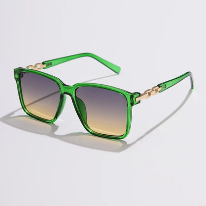 Lorya — Übergroße quadratische Sonnenbrille mit goldenen Kettenglied-Bügeln