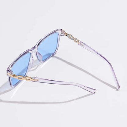 Lorya — Übergroße quadratische Sonnenbrille mit goldenen Kettenglied-Bügeln